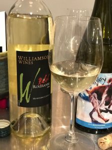 bottle of Williamson 2018 Roussane with wine in glasses