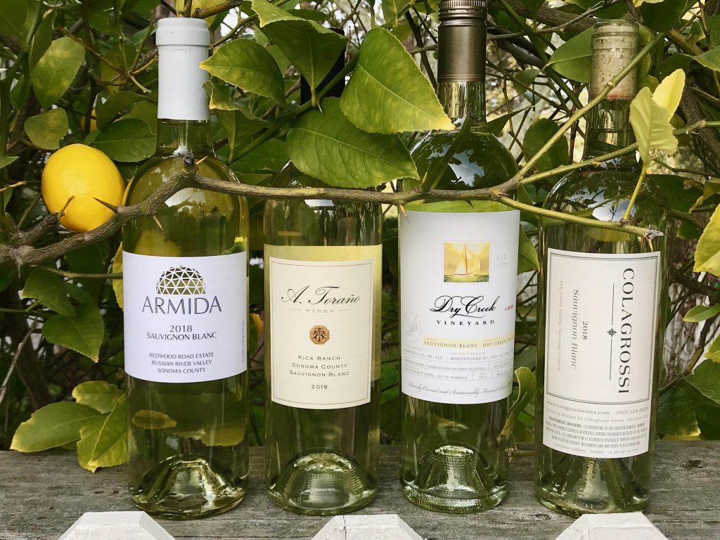 Bottles of Sauvignon Blancwith lemon tree in background