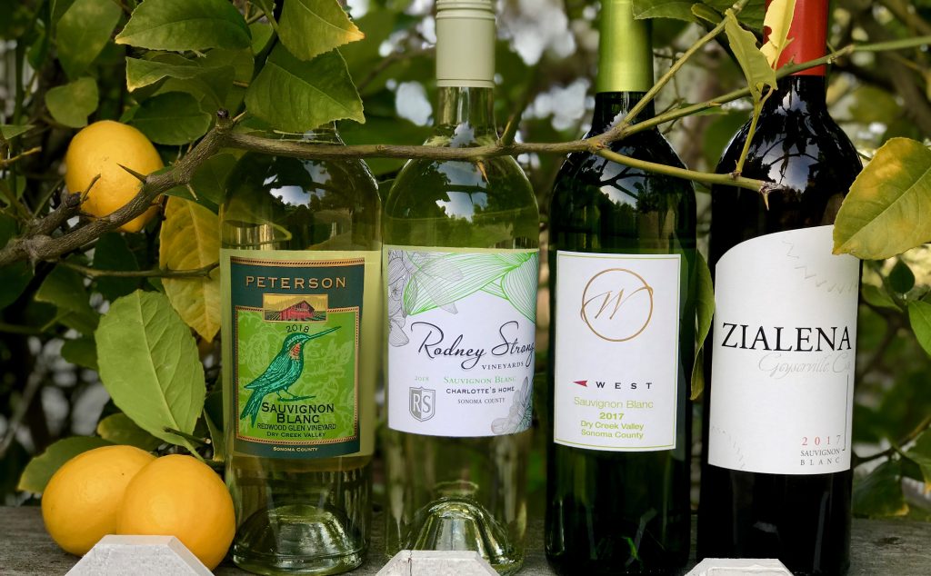 sauvignon Blanc bottles with lemon tree in background