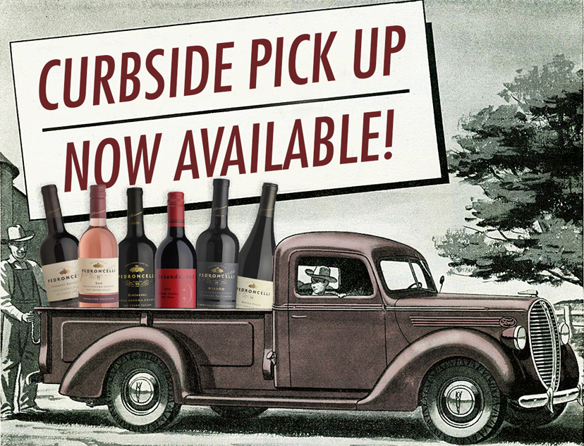 Vintage pickup filled with oversized bottles of Pedroncelli Winery wines with a sign above stating Curbside Pick Up Now Available.