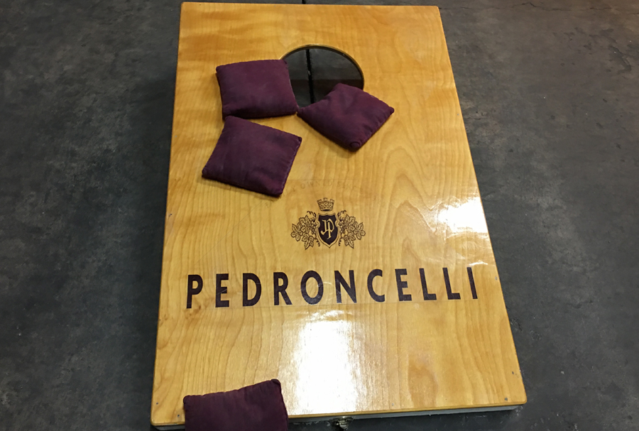 Corn hole with the Pedroncelli logo.