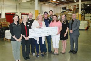 Wine Road Board Members and Executive Director Beth Costa present a $20,000 check to the staff at the Redwood Empire Food Bank