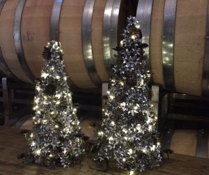 Silver trees in front of wine barrels
