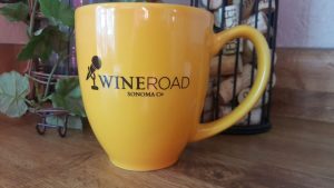 mug that has a microphone and the Wine Road logo