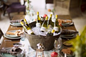 Table set for a meal with a ice bucket filled with Sonoma Cutrer Chardonnay