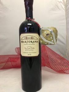 Bottle of Martorana 2014 Cabernet Sauvignon with a Christmas ornament on it.