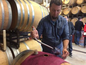 Assistant winemaker at Stuhlmuller pouring Cabernet Sauvignon futures