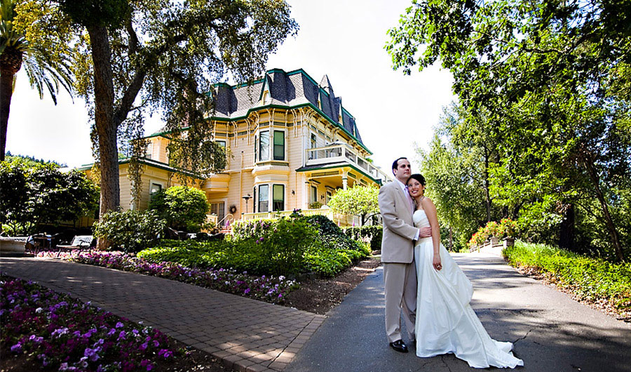 Happy wedding couple outside of the Madrona Manor.