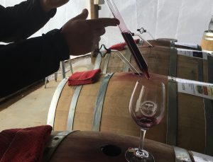 Wine thief pouring wine into a Wine Road glass