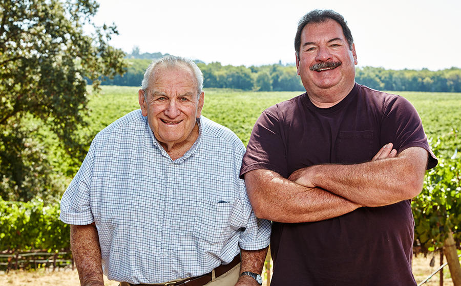 Joe Jr. and Tom Rochioli in front of their vineyard