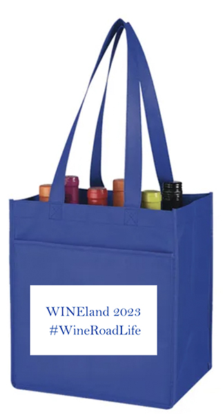 blue six bottle cloth wine bag holding six bottles. Sign on the front reads WINEland 2023, #WineRoadLife