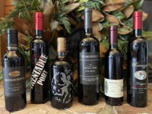Port and late harvest wines in fornt of a wreath